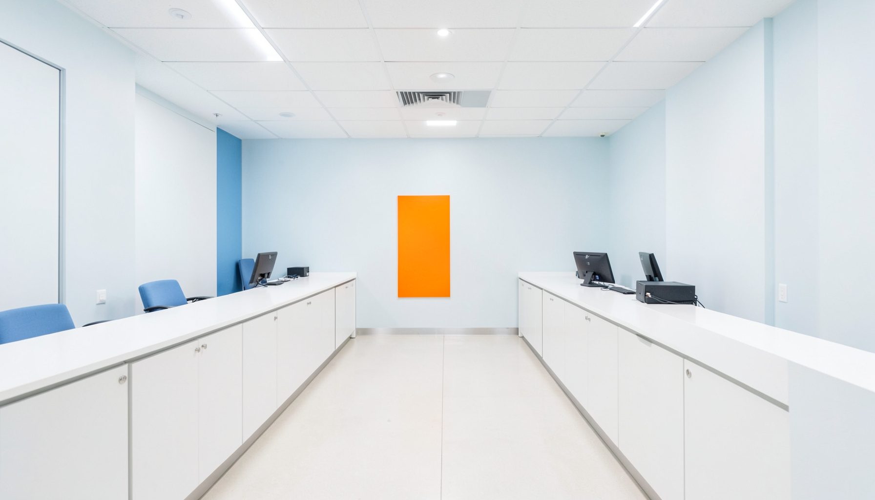 Bright hospital nursing station with clean white counters and soft blue accents, calm professional mood